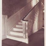 First-floor entryway with carved staircase