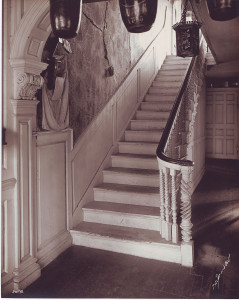First-floor entryway with fire buckets and carved newel post